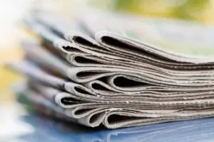 stack of folded newspapers