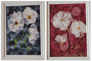 two alcohol ink paintings of white flowers