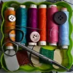 spools of thread, needle, scissors and buttons, links to more information